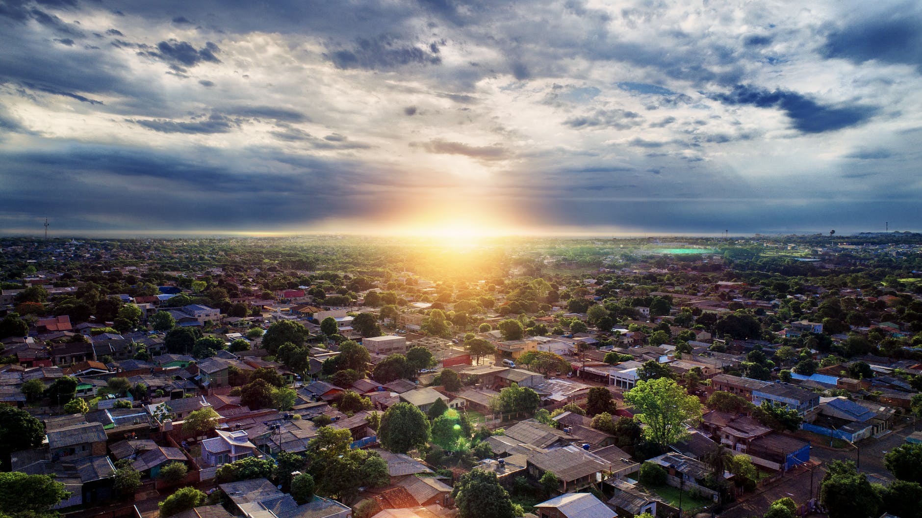 aerial photography of buildings under blue and white sky during golden hour